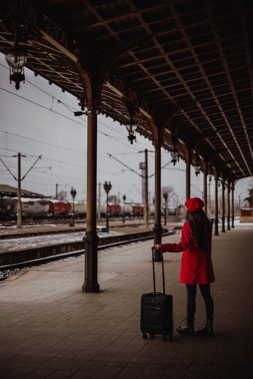 A woman waits for a train