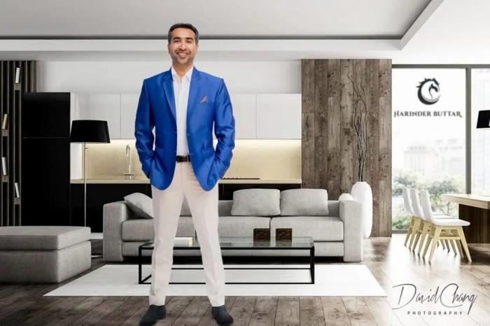A person in a blue suit
Description automatically generated with low confidence