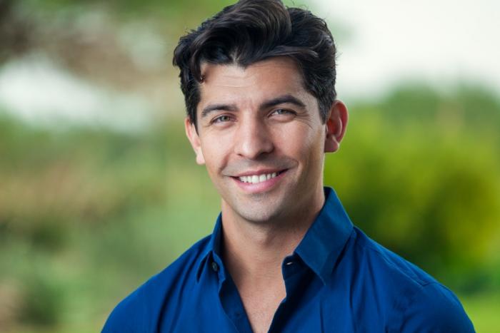A person smiling for the camera
Description automatically generated with medium confidence